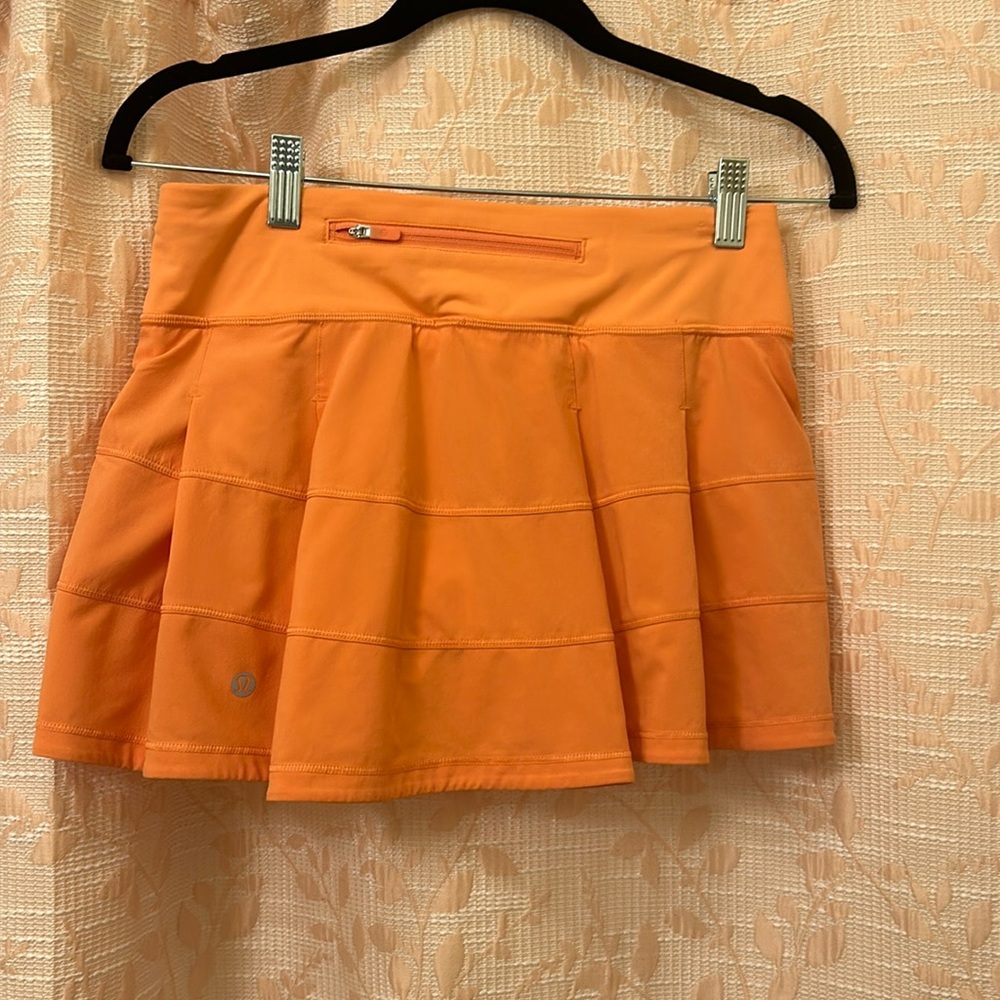 Lululemon pace rival skirt. Amazing condition. Size 4. Salmon/light orange pink